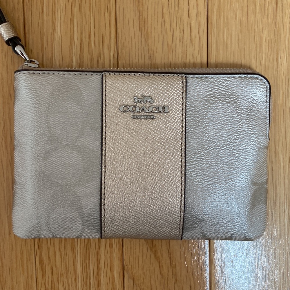 NWT and with original box.  Coach Wristlet.  sliver/platinum.